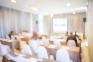 Conference presentation room with tables and chairs